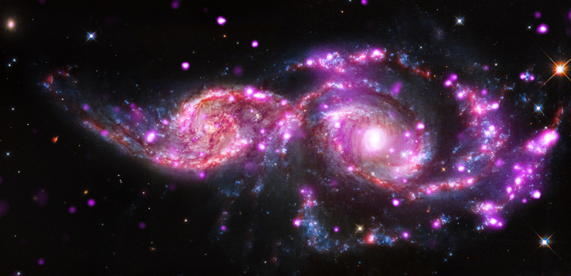 Illustration for article titled This Galactic Collision Is A Beautiful Spawning Ground For Supernovae